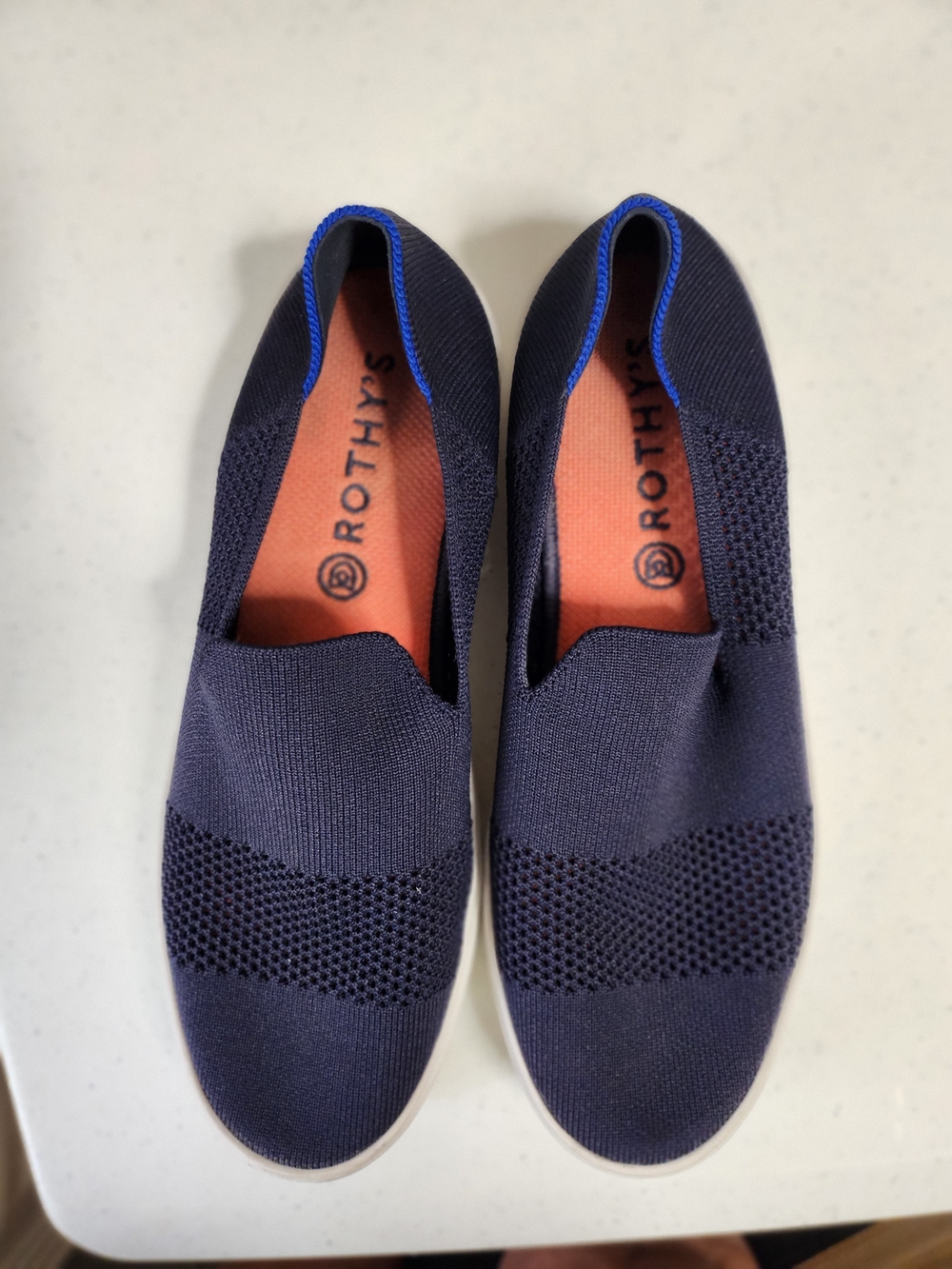 Rothy's Navy Blue Slip-On Flats with Coral Insole